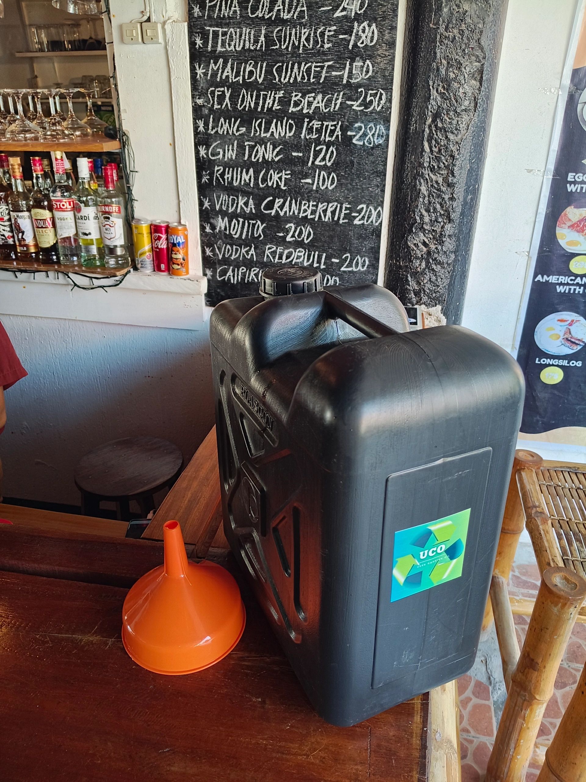Sealed collection container and funnel in a restaurant