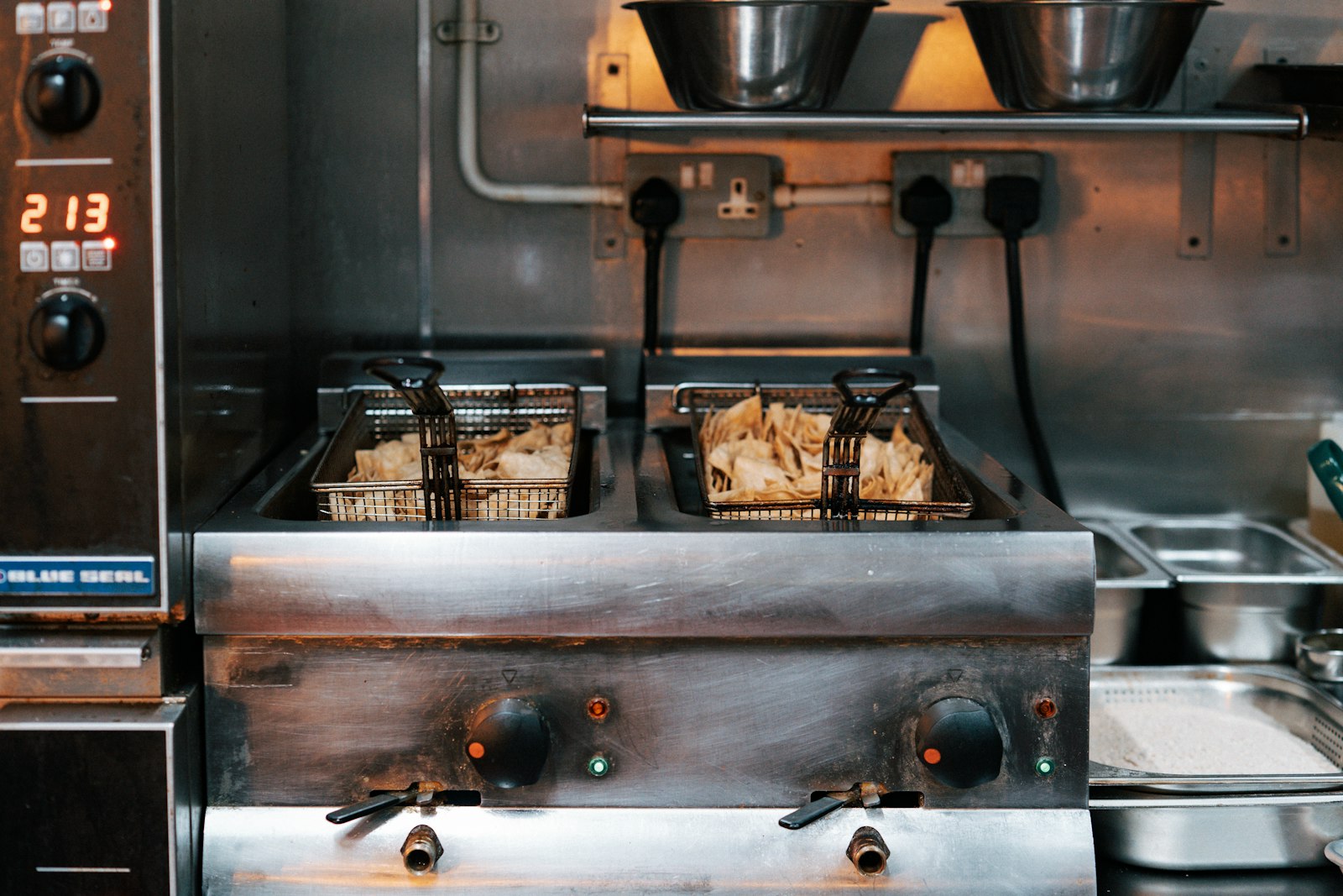 Commercial deep fryers in a restaurant kitchen